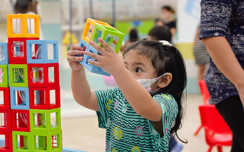 A child playing with colourful blocks